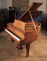 A 1935, Steinway Model S baby grand piano for sale with a polished, figured walnut case and spade legs. Price includes rebuild. Piano has an eighty-eight note keyboard and a two-pedal lyre.  