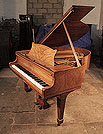 A 1935, Steinway Model S baby grand piano for sale with a polished, figured walnut case and spade legs. Price includes rebuild. Piano has an eighty-eight note keyboard and a two-pedal lyre. 