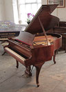 A 1937, Steinway Model S baby grand piano with a mahogany case and cabriole legs 