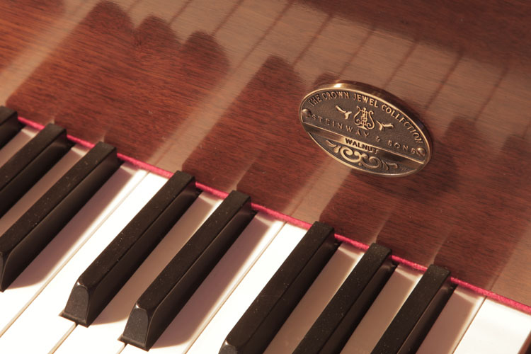 Steinway  Crown Jewel Collection plaque on fall. We are looking for Steinway pianos any age or condition.