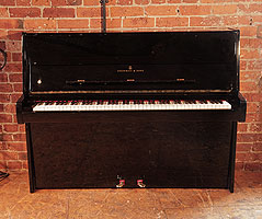  Reconditioned, 1981, Steinway Model Z upright piano with a black case and brass fittings. Piano has an eighty-eight note keyboard and two pedals.