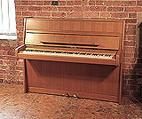 Piano for sale. A 1981, Steinway Model Z upright piano with a polished, walnut case