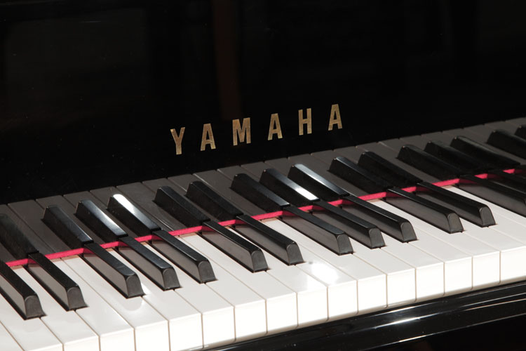 Yamaha C1 baby grand piano manufacturers logo on fall