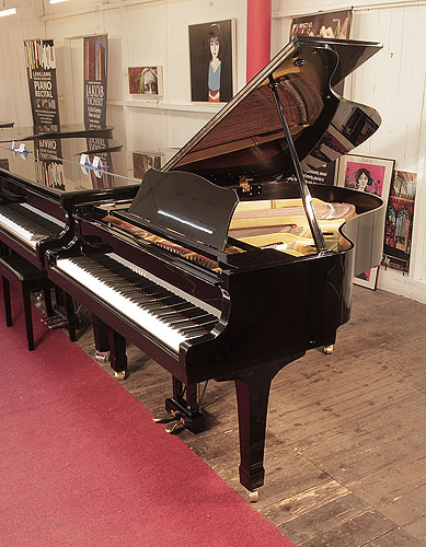 A  1978, Yamaha G2 grand piano for sale with a black case and spade legs 