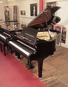 A 1978, Yamaha G2 grand piano for sale with a black case and spade legs