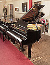 Piano for sale. A 1978, Yamaha G2 grand piano for sale with a black case and spade legs