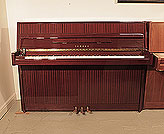 Piano for sale. Reconditioned, 1988, Yamaha M108 upright piano with a mahogany case and brass fittings