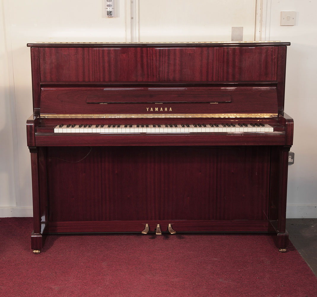 Yamaha P121N Upright piano for sale with a mahogany case and brass fittings. Modern Yamaha