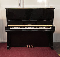 A 1986, Yamaha U3 upright piano for sale with a black case and brass fittings 