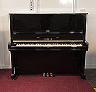 Piano for sale. Reconditioned, 1986, Yamaha U3 upright piano for sale with a black case and brass fittings. Piano has an eighty-eight note keyboard and three pedals.  