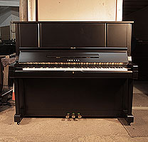 Reconditioned, 1981, Yamaha YUX upright piano for sale with a satin, black case and brass fittings. Piano has an eighty-eight note keyboard and three pedals. 