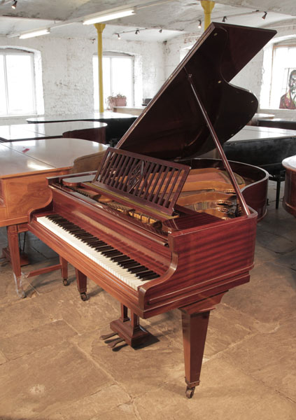 A 1928, Bechstein Model L grand piano for sale with a mahogany caseand square, tapered legs. Piano has an eighty-eight note keyboard and a two-pedal lyre. 