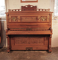 Reconditioned, 1908, Feurich upright piano with a walnut case, burr walnut panels and an unusual walnut keyboard Piano has an eighty-five note keyboard and two pedals