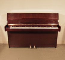 A 1985, Kawai CX-4S Upright Piano For Sale with a Mahogany Case and Brass Fittings. Piano has an eighty-eight note keyboard and two pedals. 