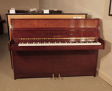 Piano for sale. A 1985, Kawai CX-4S Upright Piano For Sale with a   Walnut Case and Brass Fittings. Piano has an eighty-eight note keyboard and two pedals. 