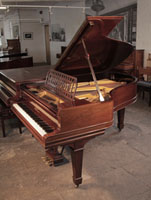 Antique, 1900, Steinway Model A grand piano with a polished, rosewood case and spade legs. Piano has an eighty-eight note keyboard and a three-pedal lyre