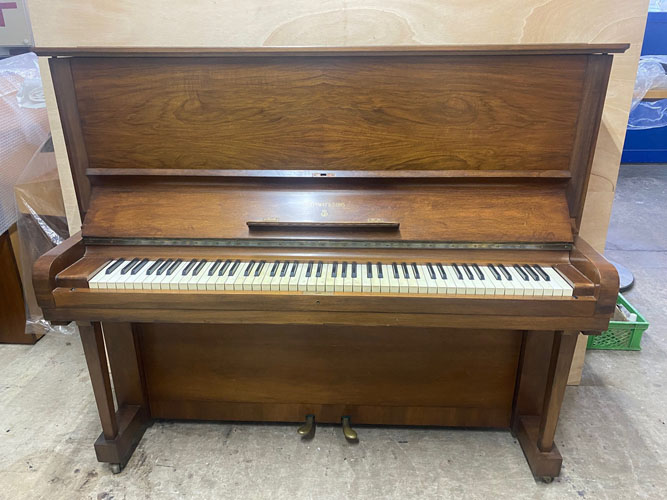 A 1954, Steinway Model K Upright Piano For Sale with a Figured Walnut Case and Brass Fittings