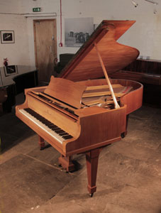 Reconditioned,  1932, Steinway Model O grand piano for sale with a satin, walnut case and spade legs. Piano has an eighty-eight note keyboard and a two-pedal lyre. 