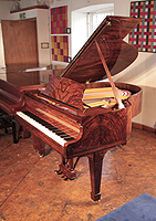 Rebuilt, 1935, Steinway Model S baby grand piano for sale with a polished, figured walnut case and spade legs.  Piano has an eighty-eight note keyboard and a two-pedal lyre.  