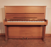 Reconditioned, 1982, Steinway Model V upright piano with a satin, quartered walnut case and brass fittings.