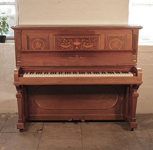 A 1904, Steinway upright piano for sale with a polished, rosewood case and inlaid panels in a Neoclassical design 