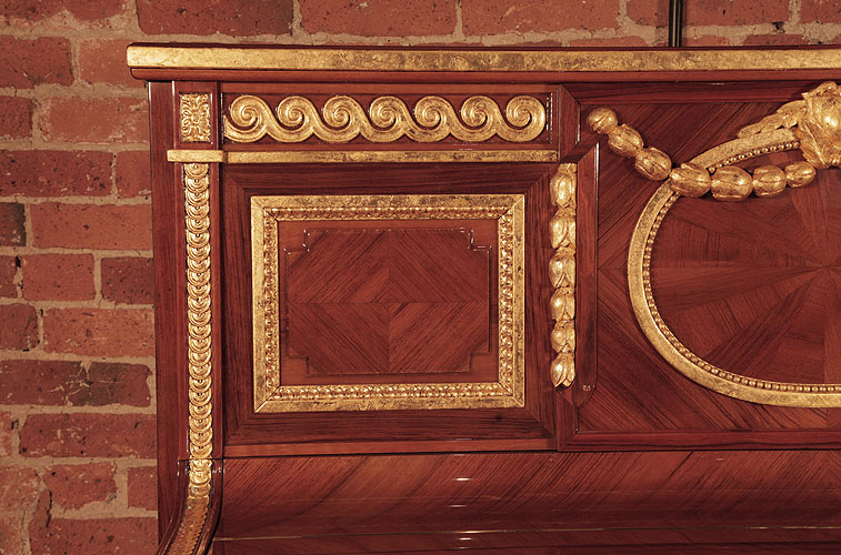 Steinway  square, side panel in quartered walnut with a gold beaded surround. Pilaster features gold strapwork with a floral rosette