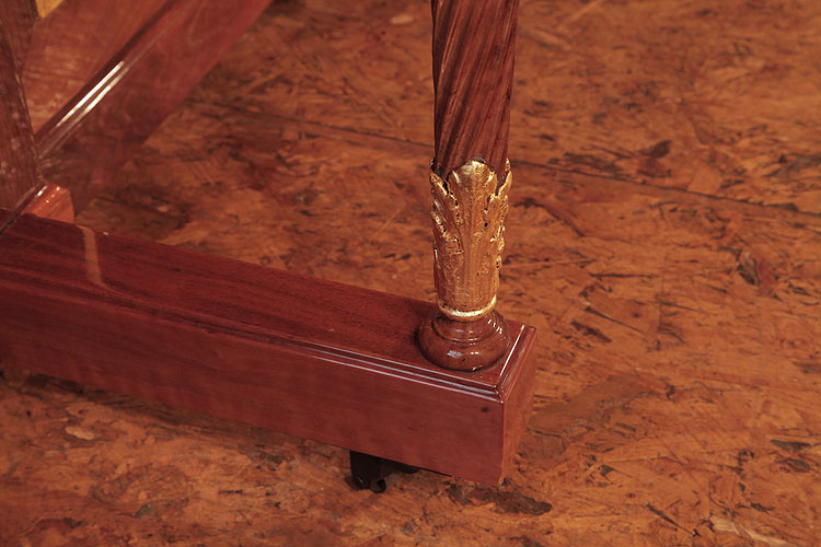 Steinway leg detail featuring acanthus leaves in gold