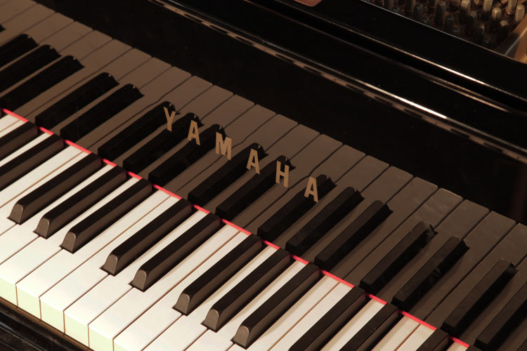 Yamaha G2 piano manufacturers logo on fall
