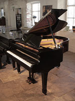 Reconditioned, 1975, Yamaha G2 grand piano for sale with a black case and spade legs. Piano has an eighty-eight note keyboard and a two-pedal lyre.