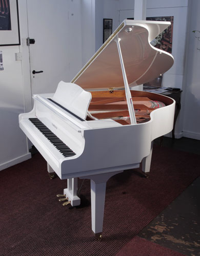A 2020, Yamaha GB1 baby grand piano for sale with a white, gloss case and square, tapered legs 