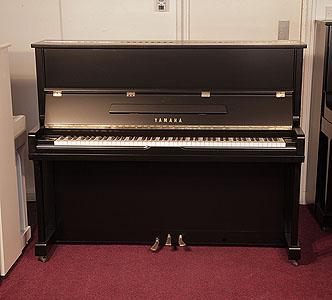 Reconditioned, 1994, Yamaha U1N Upright piano for sale with a satin, black case and brass fittings. Piano has an eighty-eight note keyboard and three pedals.  
