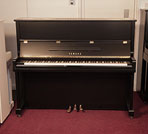 Piano for sale. A 1994,  Yamaha U1N Upright piano for sale with a satin, black case and brass fittings. Piano has an eighty-eight note keyboard and three pedals  