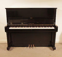 Reconditioned, 1965, Yamaha U2 upright piano with a black case and polyester finish. Piano has an eighty-eight note keyboard and three pedals.