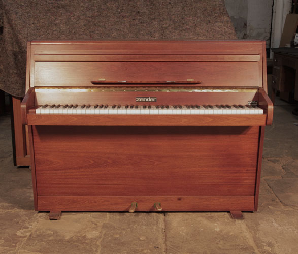 Pre-owned Zender upright piano with a polished, walnut case and brass fittings 