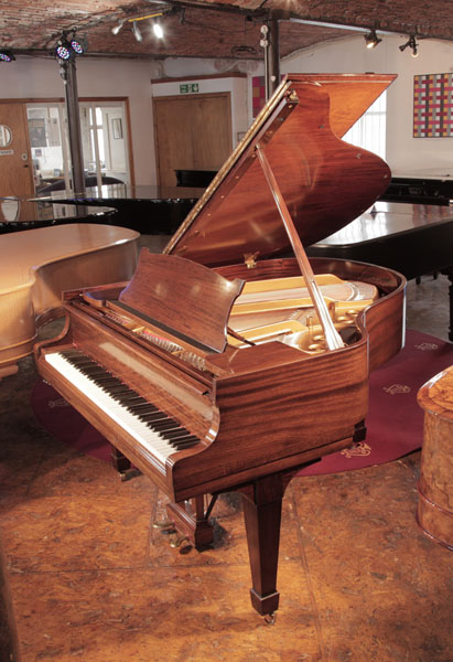  Rebuilt, 1937 Steinway Model S baby grand piano with a  crown cut  mahogany case and spade legs. Piano has an eighty-eight note keyboard and a two-pedal lyre. 