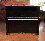 Reconditioned, 2002, Steinway Model V upright piano with a polished, black case with brass fittings. Piano frame signed by Lang Lang. Piano has an eighty-eight note keyboard and two pedals. 