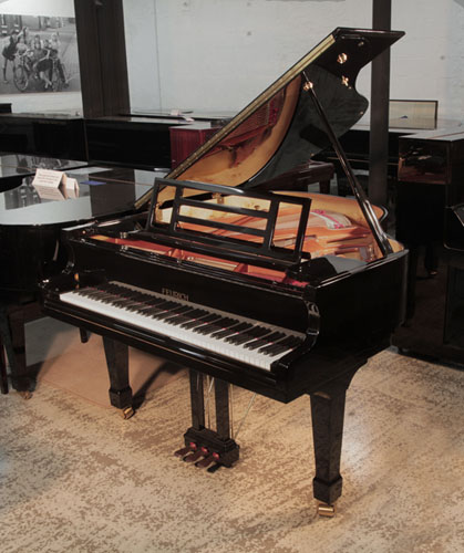 Reconditioned 2015, Feurich Model 161 Professional I baby grand piano with a black case and brass fittings Piano has an eighty-eight note keyboard and a three-pedal piano lyre.
