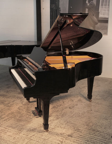 Reconditioned, 2010, Opus grand piano for sale with a black case and brass fittings