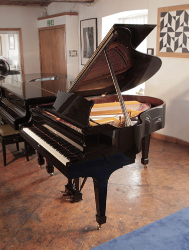 Restored,  1961, Steinway Model M grand piano with a black gloss case and spade legs. Piano has an eighty-eight note keyboard and a two-pedal lyre.