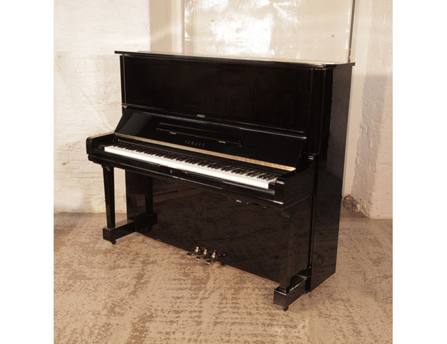 Reconditioned, 1972, Yamaha U3 upright piano for sale with a black gloss case and fitted Adsilent system. Piano has an eighty-eight note keyboard and three pedals. 