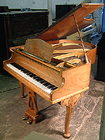 Monington and Weston Baby Grand Piano with a figured walnut case