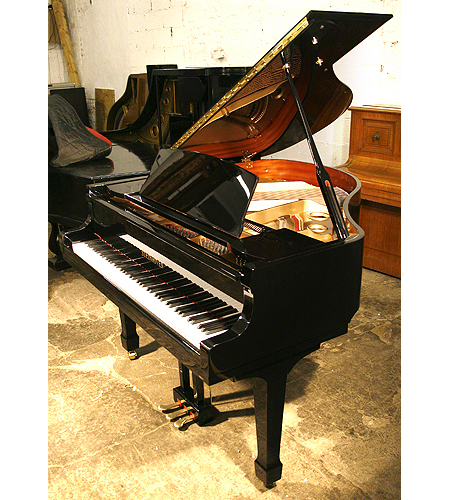 Brand new Steinhoven Model 148 baby grand piano with a black case and brass fittings