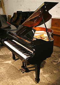 A brand new Steinhoven Model 148 baby grand piano with a black case and polyester finish. 