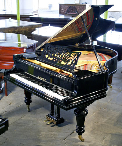 Restored, Berdux  grand piano with a  black case, filigree music desk and turned legs