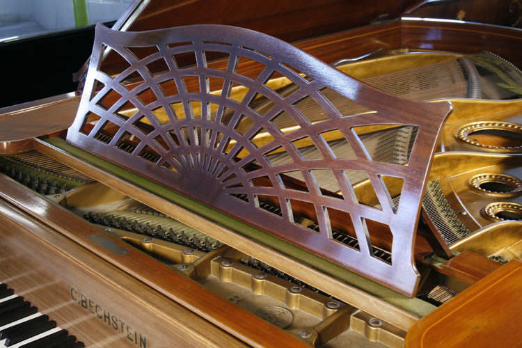Bechstein piano music desk in an openwork sunset design
