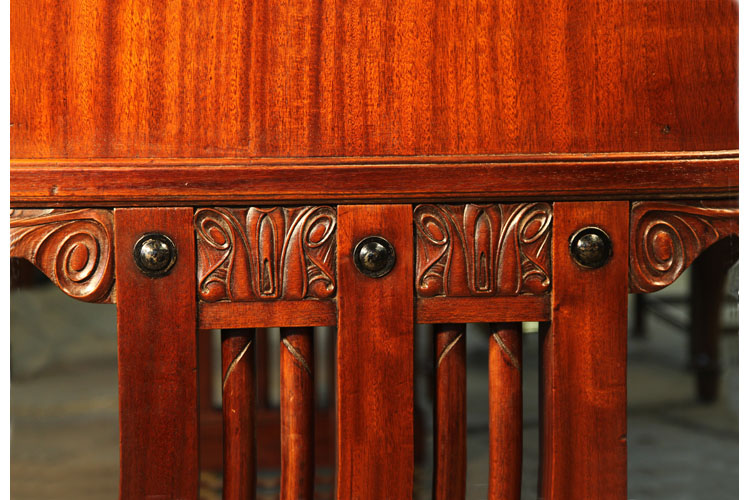 Stylised flowers  carved decoration at the top of piano leg