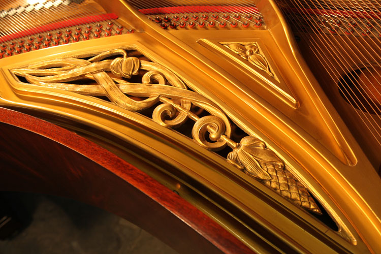 Ibach  piano frame featuring sinuous foliage and flower head