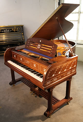 Arts and Crafts Lipp  grand piano for sale with a mahogany case with inlaid detail