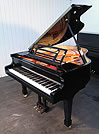 Piano for sale. A Feurich model 161 grand piano with a black case and polyester finish. 