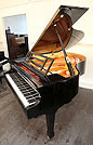 Piano for sale. A Feurich model 178 grand piano with a black case and polyester finish. 